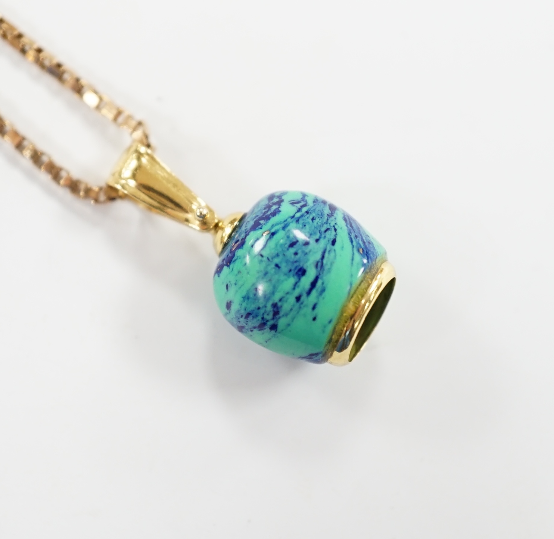 A modern 750 yellow metal, baroque pearl and enamelled charm, 14mm, on a 9ct chain, 56cm, gross weight 7.6 grams.